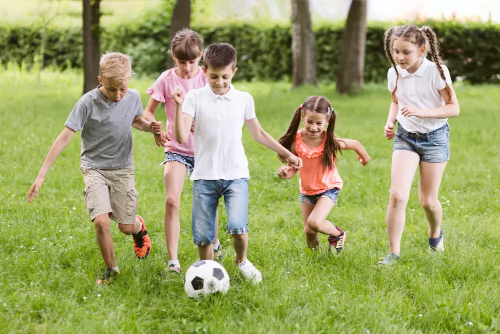 Children playing football outdoors