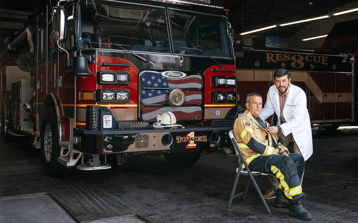 medical provider treating a fire fighter patient medical provider treating a fire fighter patient