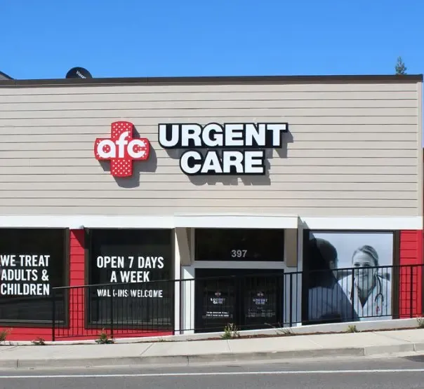 Image of a smiling female nurse at AFC Urgent Care.