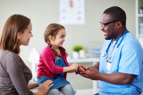 pediatric patient during doctor's visit smiling