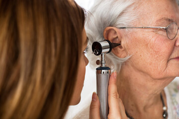 Older lady complaining of ear pain from the pool and is being seen by a provider at AFC Urgent Care West Springfield for swimmer’s ear relief