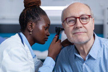 Old man visiting AFC Urgent Care Rocky Hill for swimmer’s ear treatment