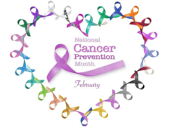 A heart-shaped arrangement of colorful awareness ribbons surrounds text that reads "National Cancer Prevention Month" and "February," with a central pink ribbon, highlighting the medical importance recognized by every medical center and urgent care facility.