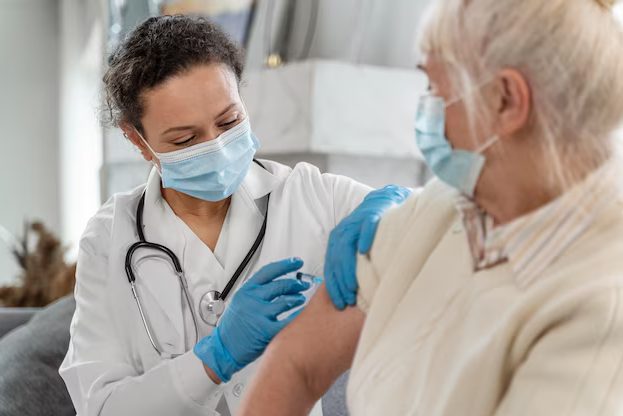 elderly man getting flu shots