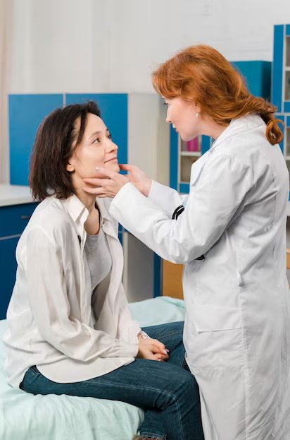 doctor checking on a patient's throat problem
