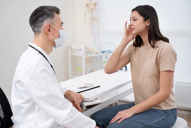 doctor performing check up on a woman