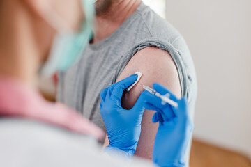 Provider at AFC Urgent Care Torrington giving a patient their yearly flu vaccine followed by an RSV test to ensure they’re safe for the winter season