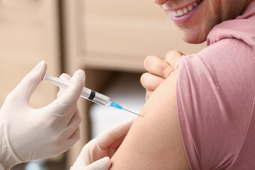  A man about to get his flu shot at AFC Urgent Care Worcester 