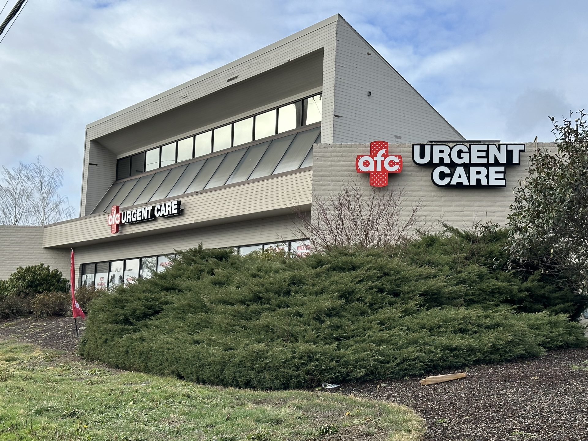 Image of a smiling female nurse at AFC Urgent Care.