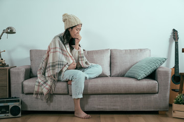 Woman holding her sore throat and inquiring AFC Urgent Care Worcester about testing for Strep Throat And COVID-19