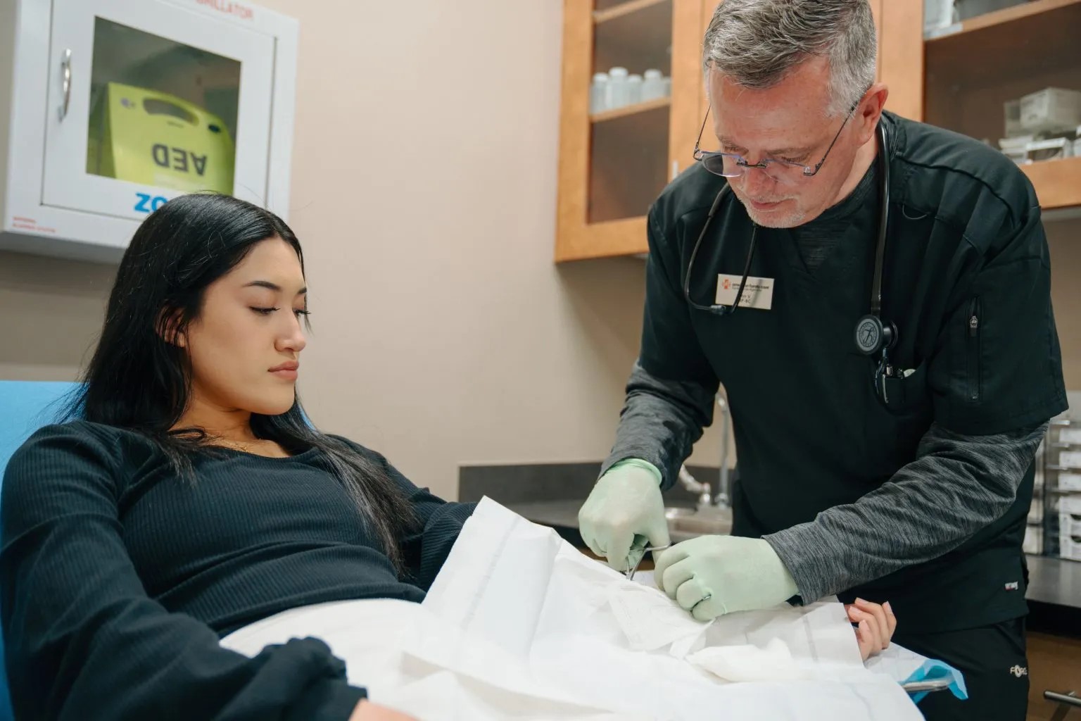 Patient getting sutures at AFC Urgent Care Fort Collins Patient getting sutures at AFC Urgent Care Fort Collins