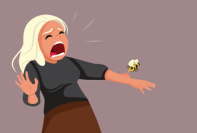 Person getting stung by an angry bee, causing a trip to AFC Urgent Care Danbury for bee sting and bee allergy treatment