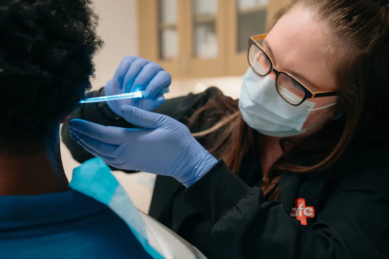 AFC medical assistant providing care for a patient